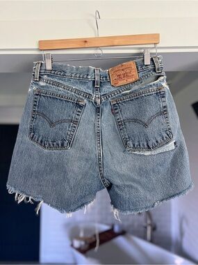 Vintage Levi’s 560 Loose Fit denim Jean shorts ripped holes